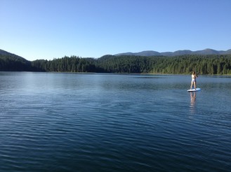 cool off in an alpine lake with a paddleboard rental